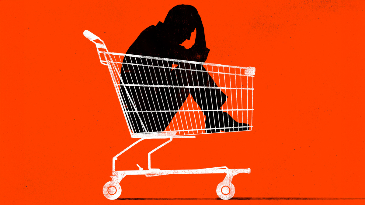 A man sitting in a shopping cart